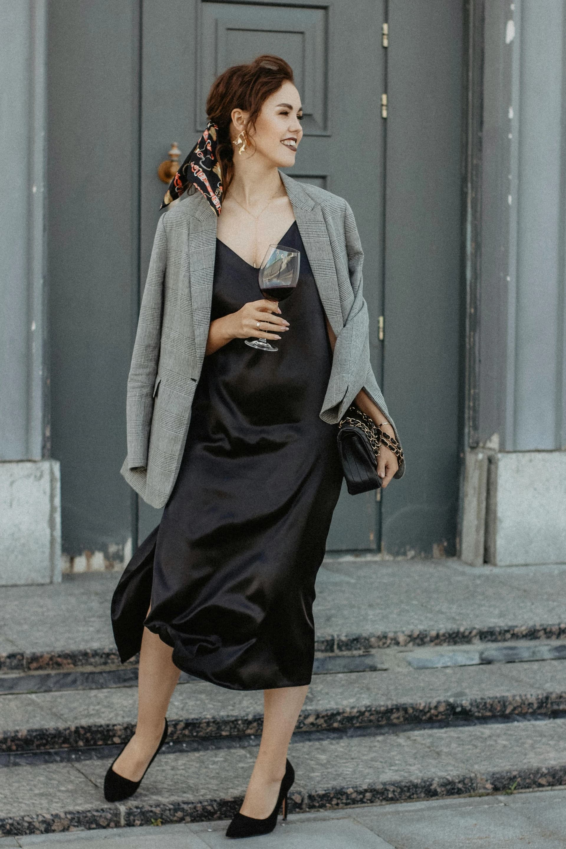 How to dress up a casual slip dress — black satin slip and blazer for
